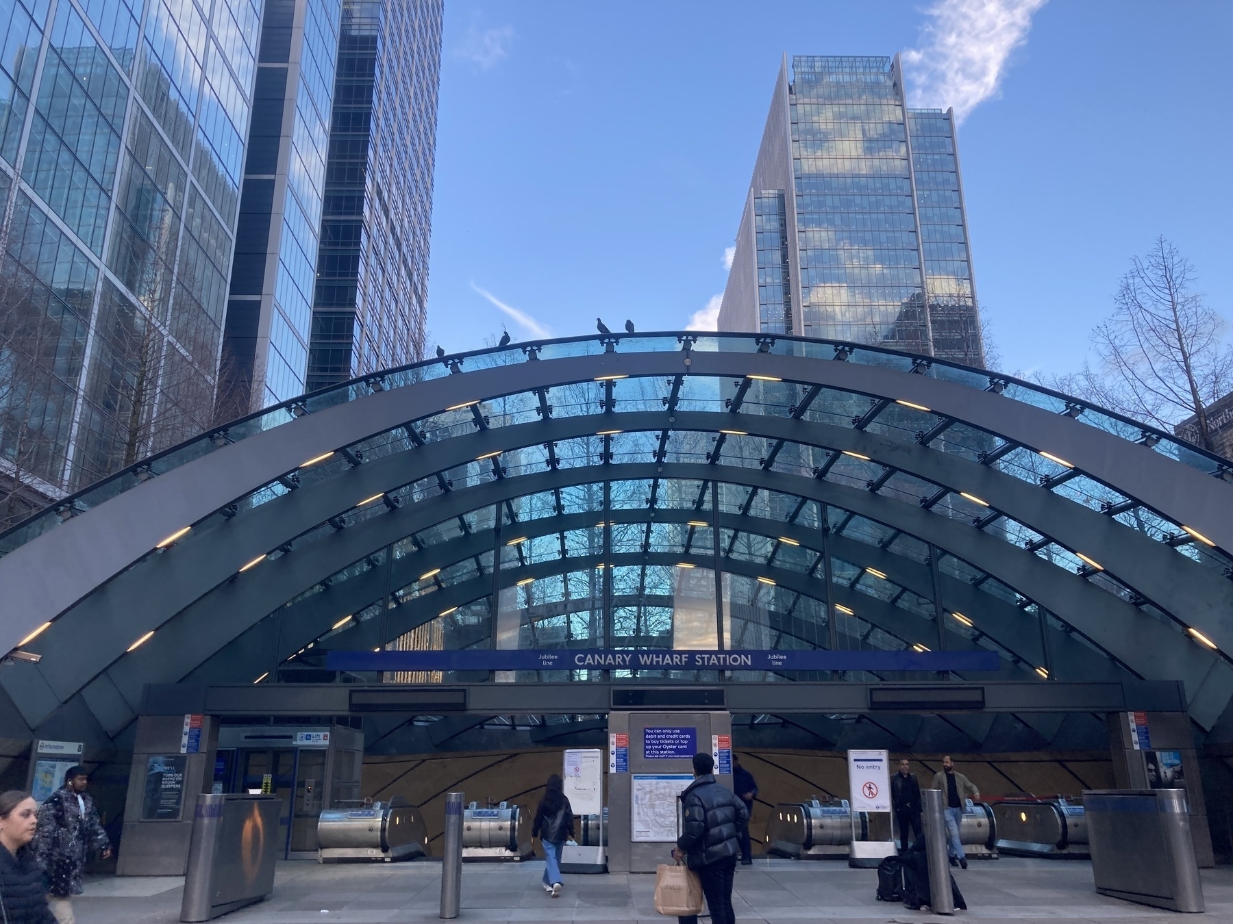 A view of the entrance to Canary Wharf underground station - with pigeons